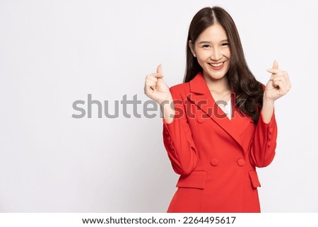 Young Asian businesswoman holding mini heart isolated on white background