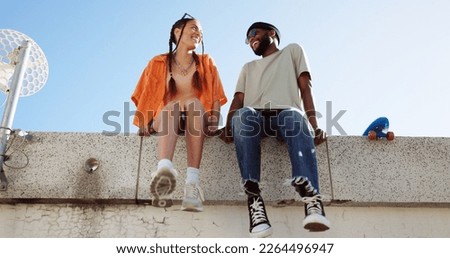 Cool, fashion and joke with young couple hang out on city building together bonding. Interracial stylish young people on a funny city date. Silly, goofy and laughing black man and woman joking Royalty-Free Stock Photo #2264496947