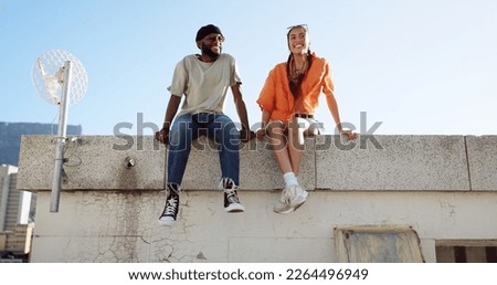 Rooftop, relax and friends for social conversation together in cool wind, sunshine and blue sky mock up space for advertising gen z youth aesthetic. Happy black people couple on urban city building Royalty-Free Stock Photo #2264496949