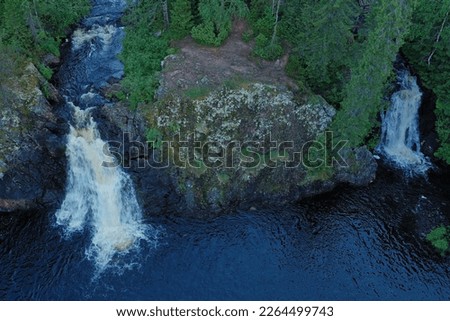 Aerial view on a summer evening of the twin falls, whose place names are Komulanköngäs. Kainuu nature and deep river - Hyrynsalmi, Finland.