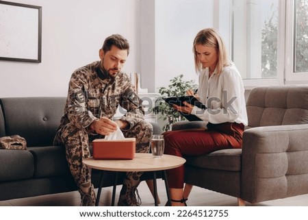 Psychologist working with military officer in office