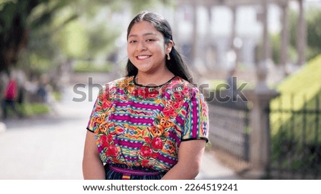 Portrait of a girl in a public area with vegetation. Royalty-Free Stock Photo #2264519241