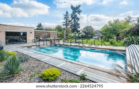 home swimming pool in garden and terrace Royalty-Free Stock Photo #2264524795