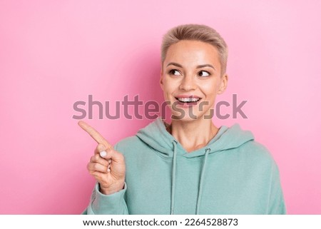 Photo of young promoter blonde hair lady wear khaki pullover direct finger mockup look shopping mall design brands isolated on pink color background
