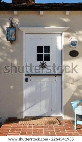 front view of vintage cottage with white front door