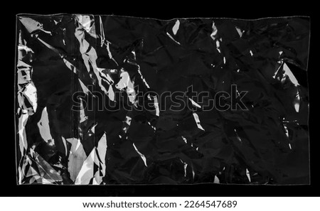 Blank transparent plastic bag overlay on black background