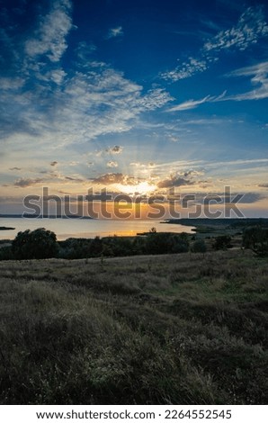 Landscape with beautiful clouds on the background of sunset in Ukraine
