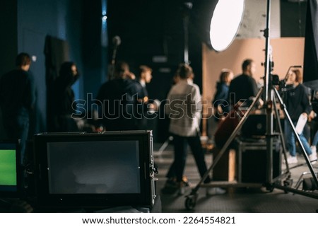 Film set, monitors and modern shooting equipment. Film crew, lighting devices, monitors, playbacks - filming equipment and a team of specialists in filming movies, advertising and TV series Royalty-Free Stock Photo #2264554821