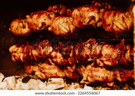 
Picture of grilled chicken cooking inside an oven. Peruvian gastronomy dish. Peruvian and South American food concept.