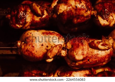 
Picture of grilled chicken cooking inside an oven. Peruvian gastronomy dish. Peruvian and South American food concept.