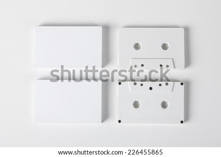 Blank audio cassettes on white background with blank packaging