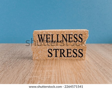 Wellness instead of stress. changed the word 'stress' to 'wellness'. Beautiful blue background. Concept. Copy space.