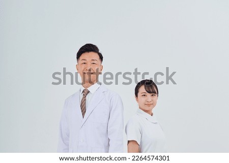 Man and woman in white coats  