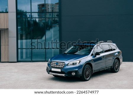 Modern subcompact crossover SUV,  beautiful wheels, large chrome grille. Royalty-Free Stock Photo #2264574977