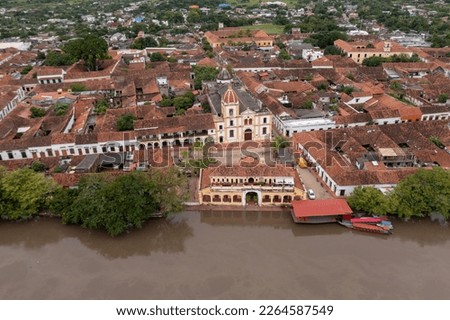 Aerial view of the main square of the town of Santa Cruz de Mompox and the port building on the banks of the Magdalena river. Bolivar Department .Colombia Royalty-Free Stock Photo #2264587549