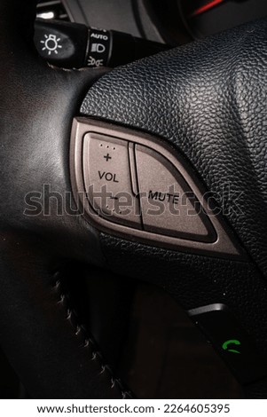 Steering wheel with volume control. Photo plus and minus audio control. High quality automotive photo
