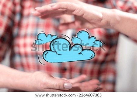 Cloud networking concept between hands of a woman in background