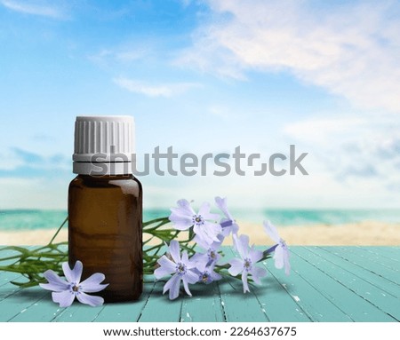 flower therapy concept, bottle and fresh aroma flowers.