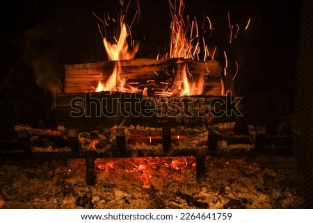 fire in fire place with flames and sparks
 Royalty-Free Stock Photo #2264641759