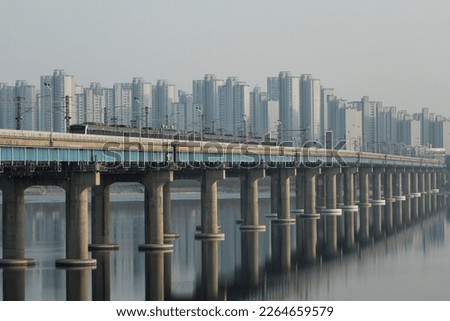 Subway running over the Jamsil Railway Bridge over the Han River Royalty-Free Stock Photo #2264659579
