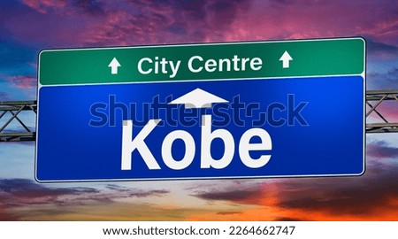 Road sign indicating direction to the city of Kobe.