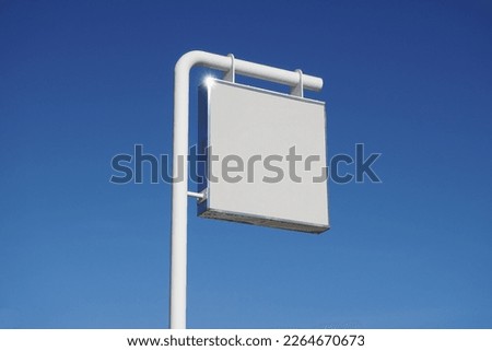 White billboard or logo on a blue sky background