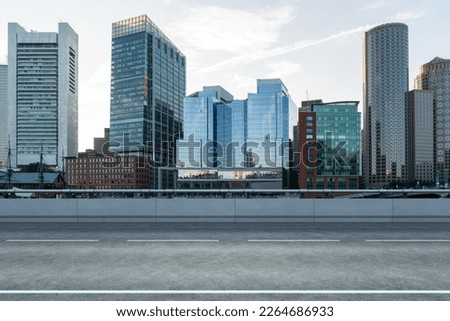 Empty urban asphalt road exterior with city buildings background. New modern highway concrete construction. Concept of way to success. Transportation logistic industry fast delivery. Boston. USA. Royalty-Free Stock Photo #2264686933