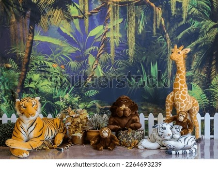 Personalized romantic safari decoration with colorful balloon arch, illustration of safari forest, for studio photo shoots.

Great for family rehearsals and also for smash the cake. Royalty-Free Stock Photo #2264693239