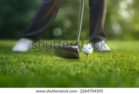 Motion action of teeing off golf ball with drivers. Royalty-Free Stock Photo #2264704505