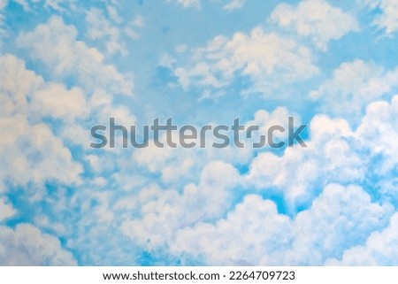 Beautiful painting of clouds and sky on cement wall. Scratched blue wall texture(backdrop surface). Concrete wall with clouds and sky picture. Abstract beautiful pattern clouds on blue sky background.