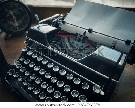 Old School Type Writer and Clock Royalty-Free Stock Photo #2264716871