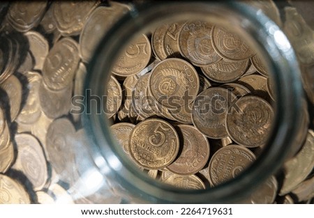 Coins of the USSR in a glass jar. Macro