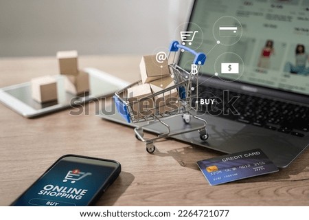 e-commerce marketing online shopping on a laptop Shopping and credit card payments for banking online, paper boxes