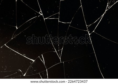 Dirty glass broken into a large number of pieces and parts, a piece of glass with a lot of cracks and broken parts Royalty-Free Stock Photo #2264723437