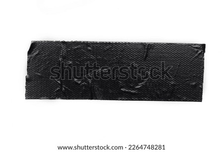 A piece of general purpose vinyl black tape isolated on white Royalty-Free Stock Photo #2264748281