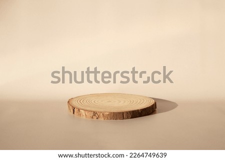 Wooden catwalk on a beige background. A space for your item, cosmetics, Bud or other.