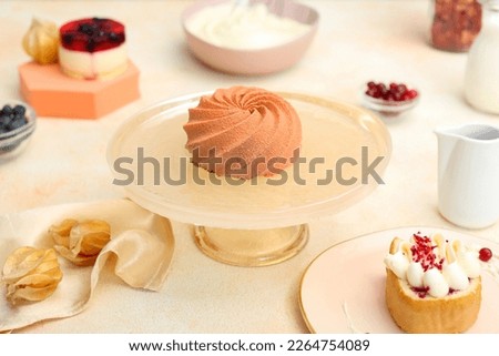 Beautiful composition of delicious desserts on white table. Food stylist