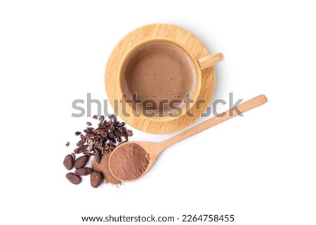 Hot chocolate cocoa drink in wooden cup and cocoa powder in wooden spoon isolated on white background. Top view. Flat lay. 