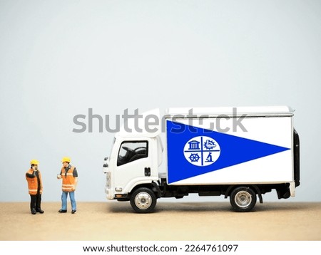 Mini toy at table with white background. Industrial shipping concept. Minneapolis flag design, is the most populous city in the U.S. state of Minnesota and the county seat of Hennepin County.