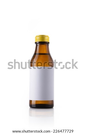 A glass bottle with vitamin with blank label reflective bottom isolated white.