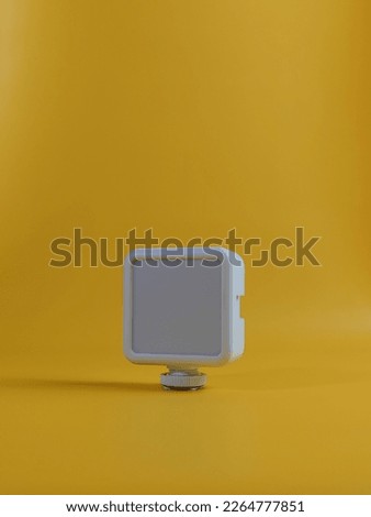 small box lighting with a yellow background