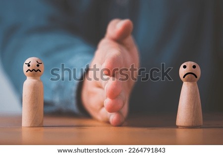 Palm hand blocking and divide between Man and woman wooden figure for resolving conflict and mediate management concept. Royalty-Free Stock Photo #2264791843