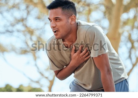 Man, runner and heart attack pain in nature while running outdoors for health and wellness. Sports, emergency thinking and male athlete with painful chest, stroke or cardiac arrest after workout. Royalty-Free Stock Photo #2264799371