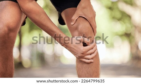 Knee pain, hands and legs injury at park after training, workout or exercise accident. Sports, fitness and man or runner with fibromyalgia, inflammation or arthritis after .exercising, running or jog Royalty-Free Stock Photo #2264799635