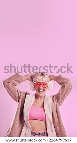 Fashion, comic and a woman with mockup in studio while laughing for funny space on pink background. Aesthetic model person with glasses for edgy vaporwave trend with creativity and color advertising