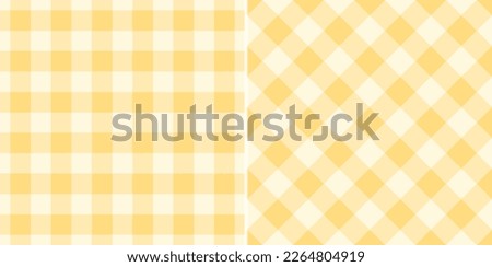 Gingham check plaid pattern in soft yellow for tablecloth, gift paper, napkin, blanket, scarf. Seamless light monochrome small vichy tartan check vector for modern spring summer fashion textile print. Royalty-Free Stock Photo #2264804919