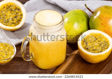 Tasty Passion Fruit Juice; Photo On Wooden Background Royalty-Free Stock Photo #2264814521