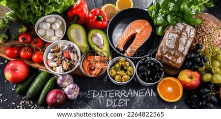 Food products representing the Mediterranean diet which may improve overall health status Royalty-Free Stock Photo #2264822565