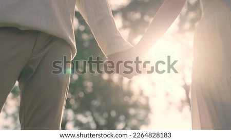 Young adult two fiance asia lover man and woman happy begin couple date life flirt sweet care touch. Asian people bride groom fall in love relax hold hand swear with trust hope on newlywed family day. Royalty-Free Stock Photo #2264828183