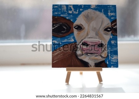 
Oil painting.Cow painting.Painting on an easel.Canvas.Idea for drawing.School of arts.
Home hobby.Drawing of a cow.Small canvases.Easel with a painting.Cool idea.School of drawing. Drawing hobby.